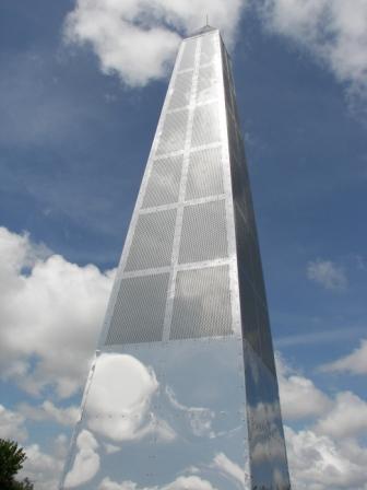 Reflective column with clouds and blue sky reflecting off sides